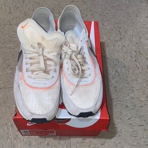 These are men Nike Waffle One . They’re a size 10. colors white, orange, brown